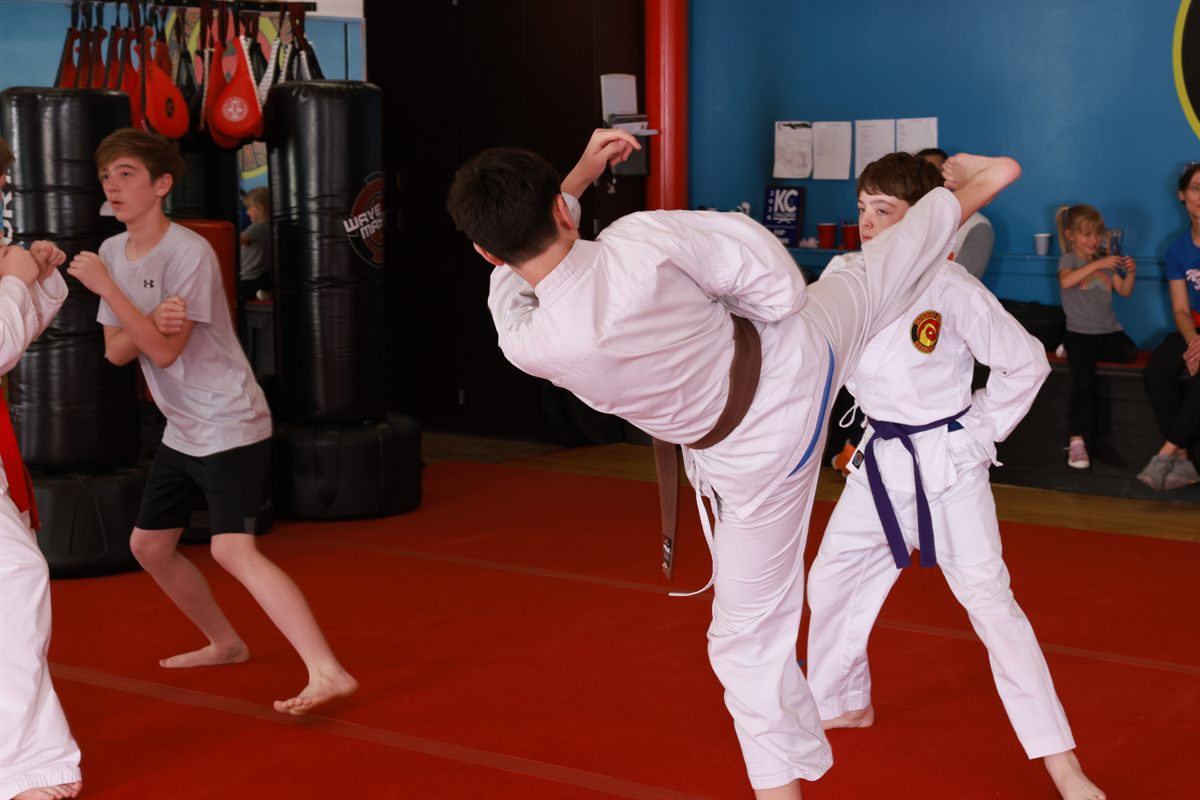Self-defense kick drill in class